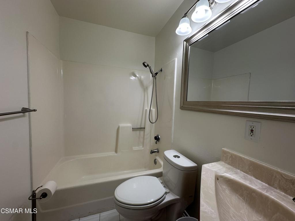 6495 Hope Street Simi Valley, CA 93063 - Photo 18 of 33 a bathroom with a toilet a sink and bathtub