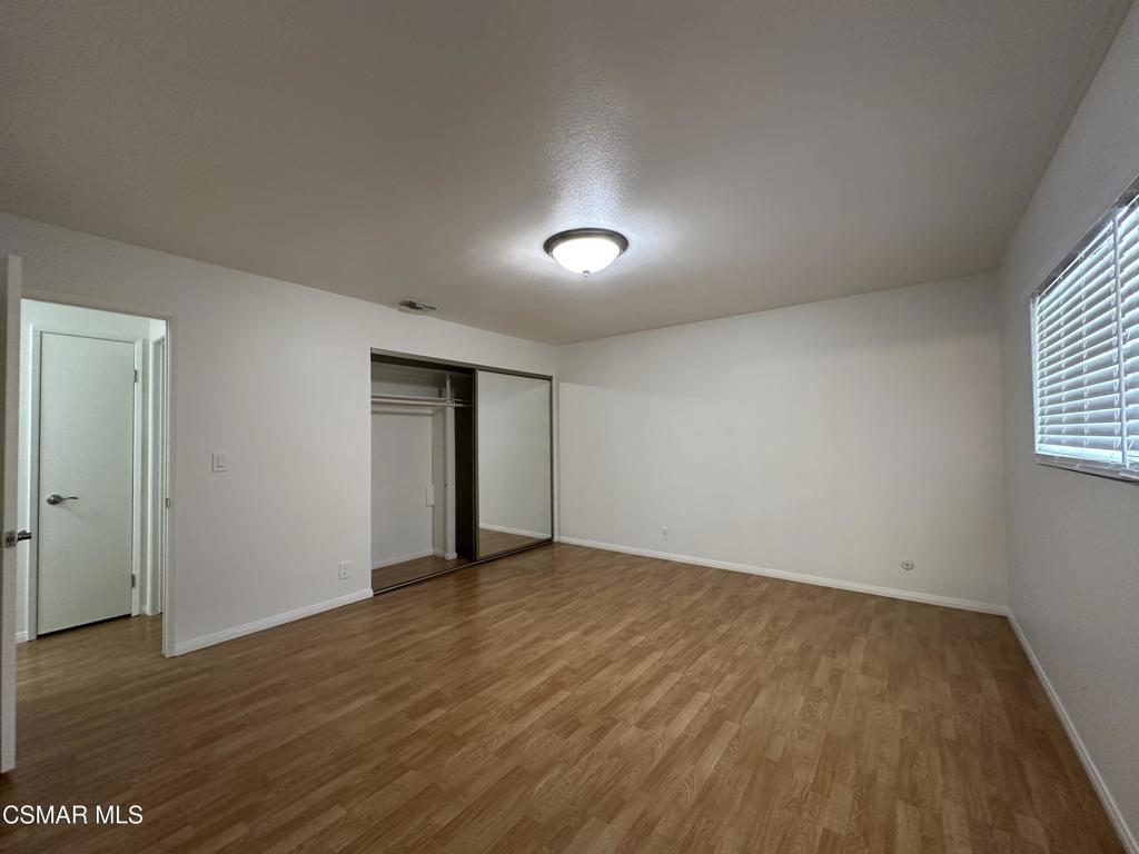 6495 Hope Street Simi Valley, CA 93063 - Photo 20 of 33 an empty room with wooden floor and windows