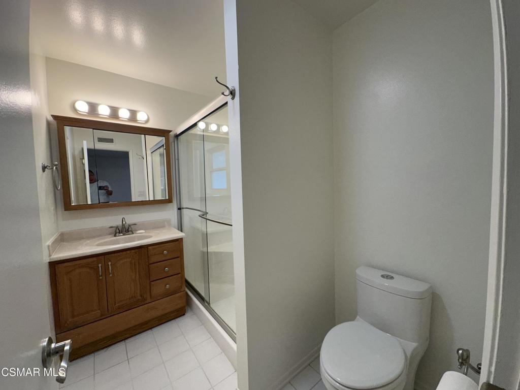 6495 Hope Street Simi Valley, CA 93063 - Photo 23 of 33 a bathroom with a toilet sink and mirror
