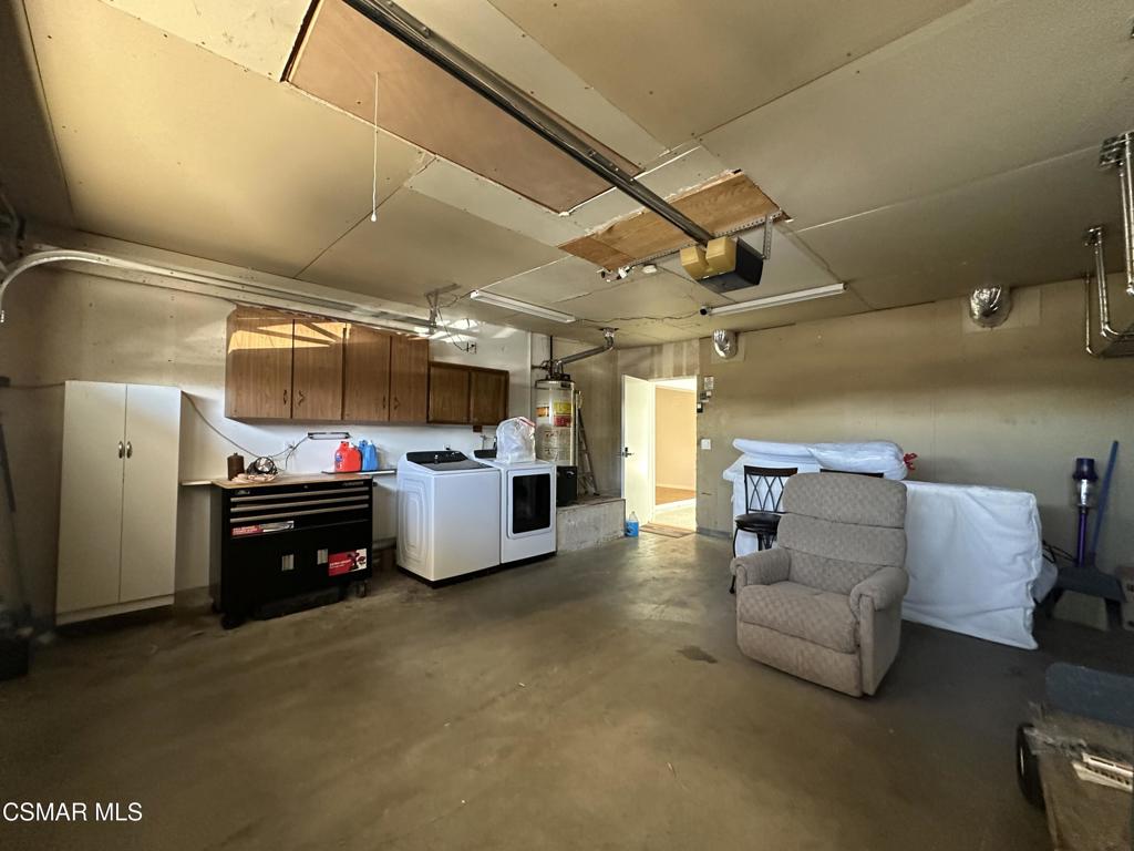 6495 Hope Street Simi Valley, CA 93063 - Photo 24 of 33 a living room with furniture and a flat screen tv