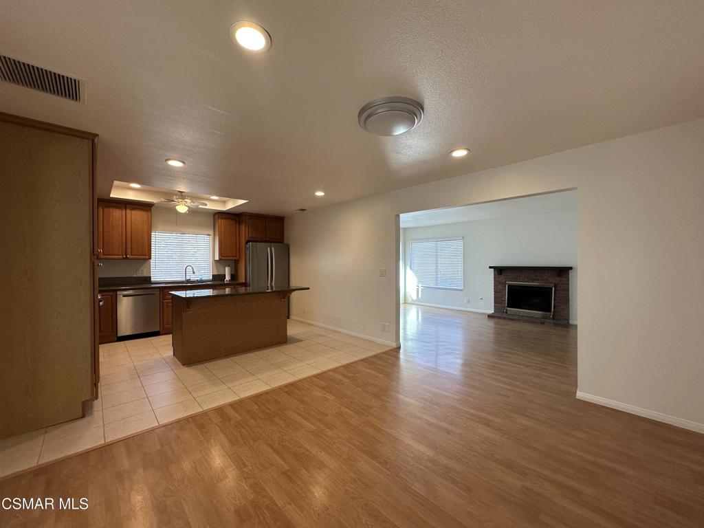 6495 Hope Street Simi Valley, CA 93063 - Photo 7 of 33 a view of kitchen with kitchen island wooden floor and center island