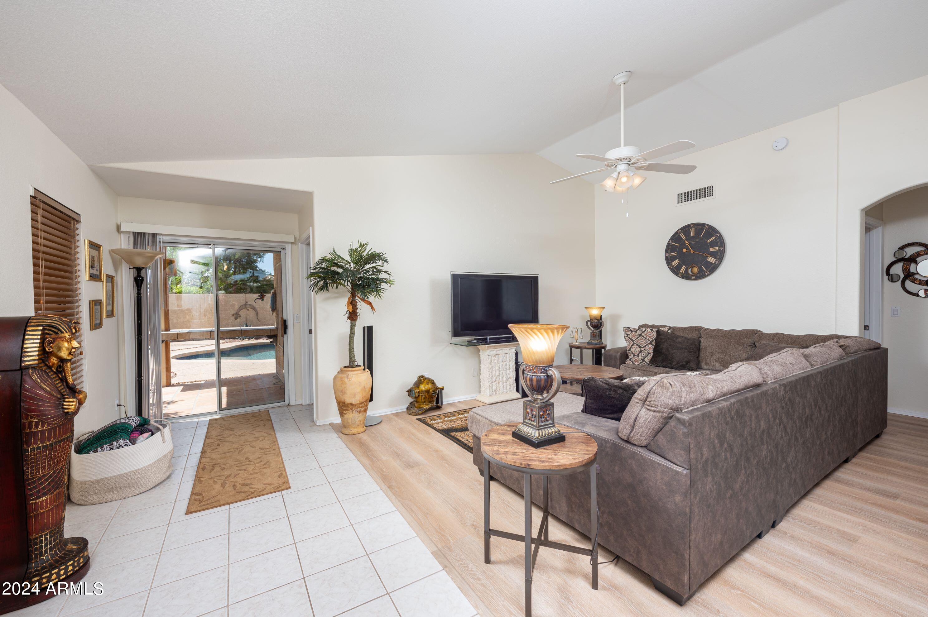 707 West Baylor Lane Gilbert, AZ 85233 - Photo 4 of 14 a living room with furniture and a rug