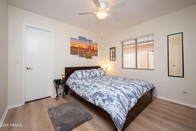 a bedroom with a bed and a dresser