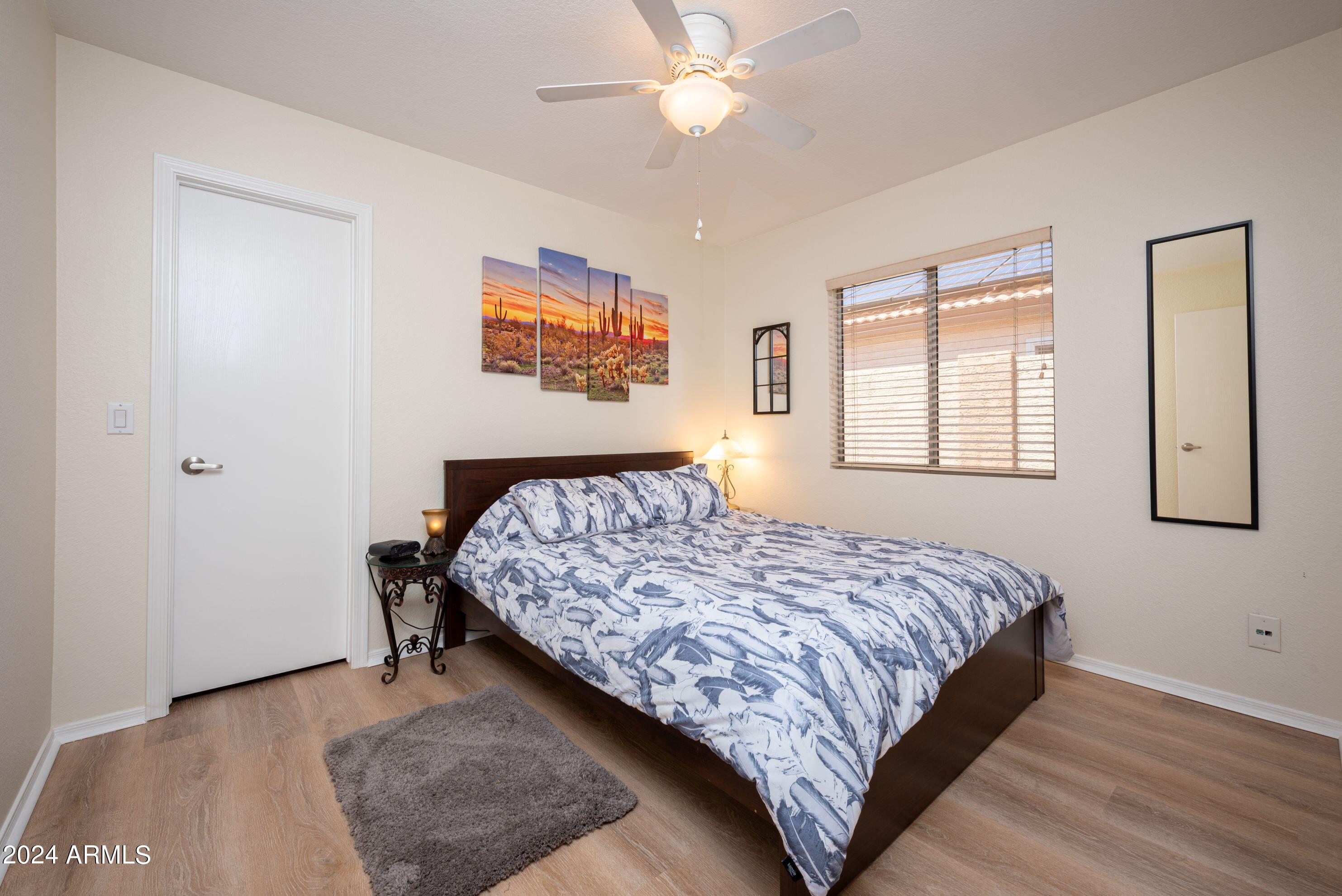 707 West Baylor Lane Gilbert, AZ 85233 - Photo 10 of 14 a bedroom with a bed and a dresser