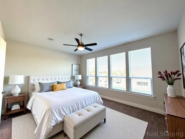 a spacious bathroom with a granite countertop sink and a mirror