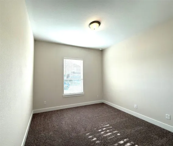 a bathroom with a bathtub and a toilet