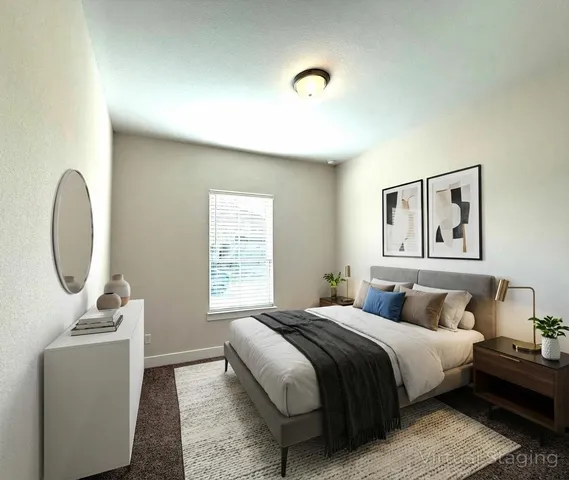 a bathroom with a sink mirror and vanity