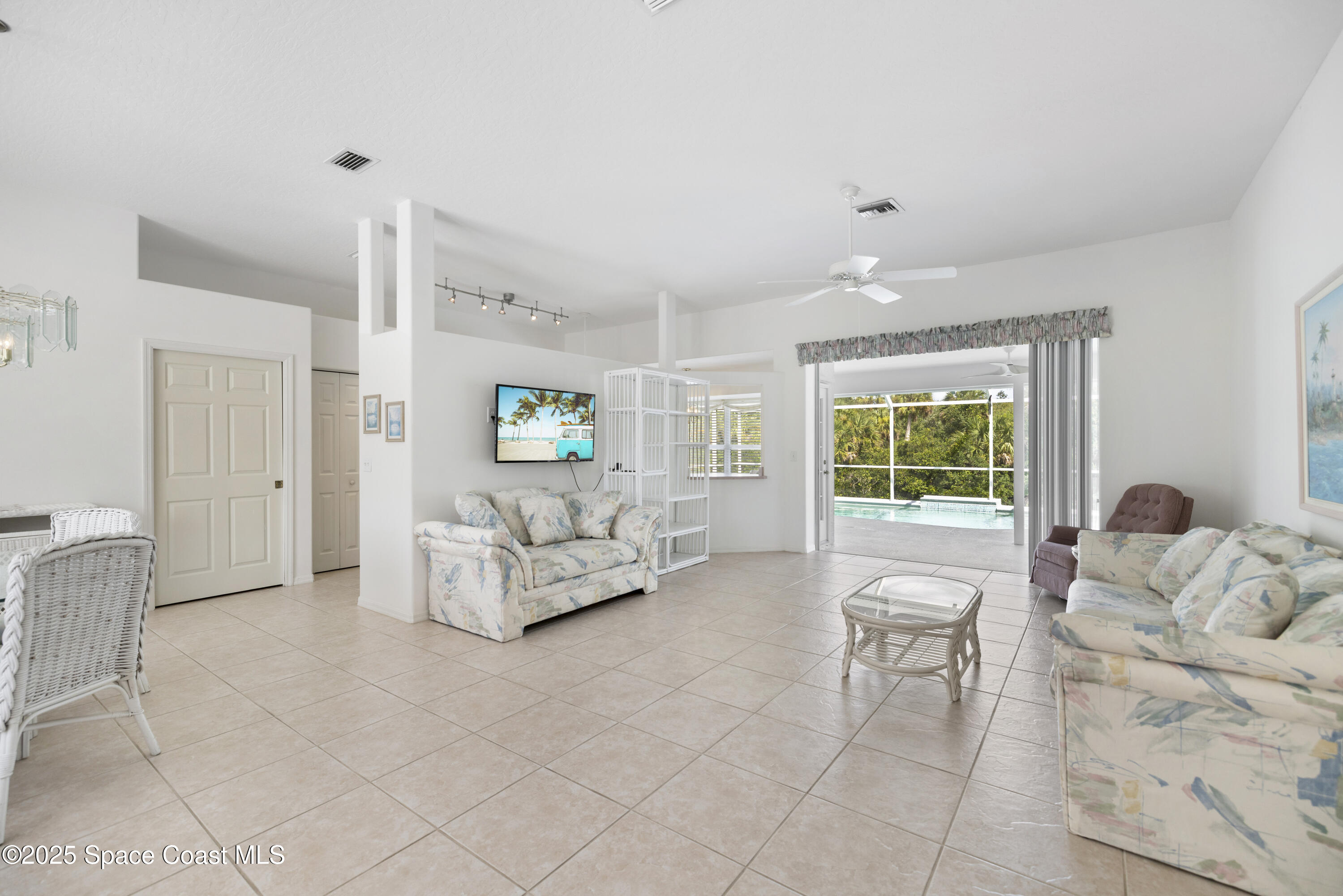 1253 George Street Sebastian, FL 32958 - Photo 12 of 37 a spacious bedroom with a bed and a couch