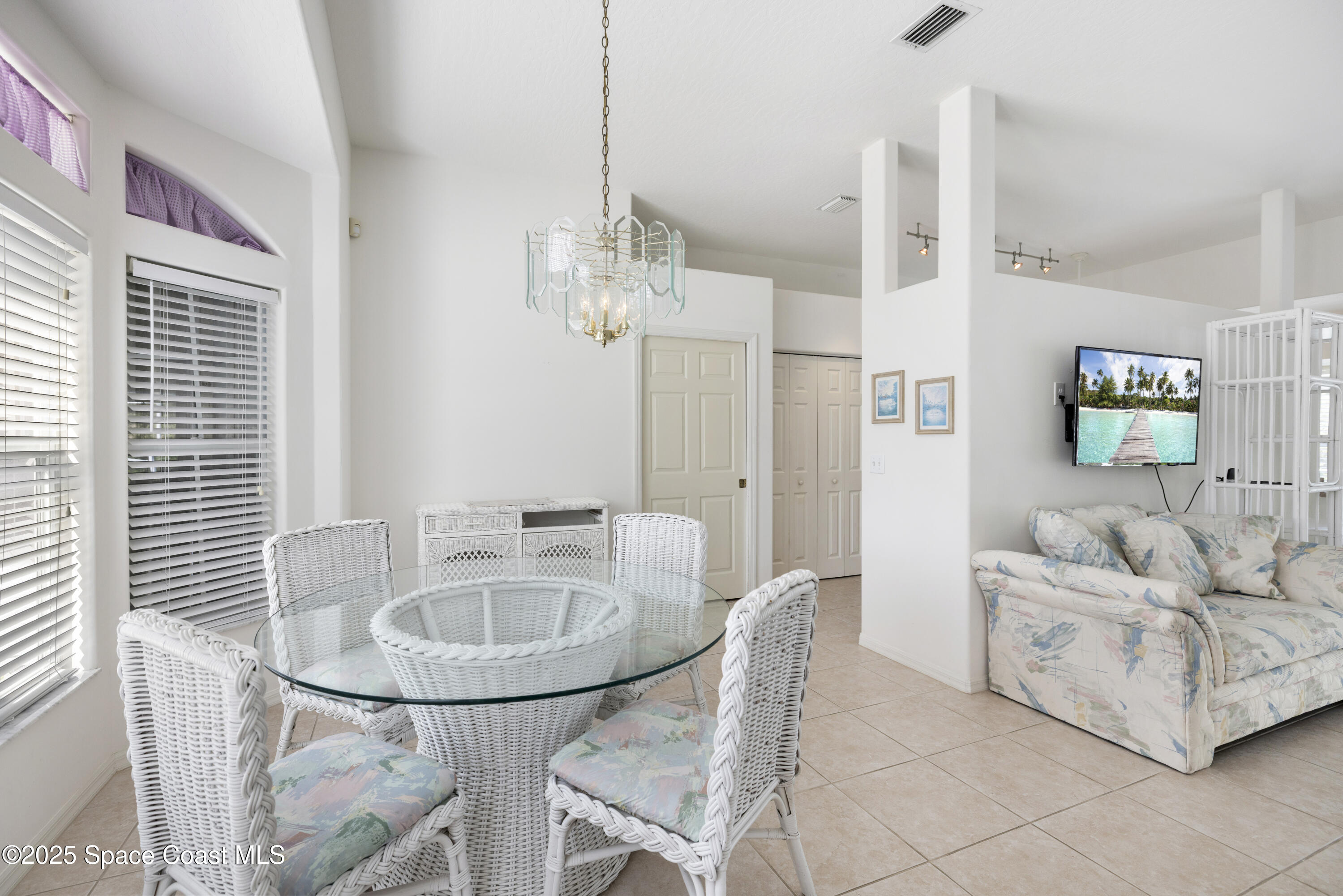 1253 George Street Sebastian, FL 32958 - Photo 16 of 37 a living room with furniture and a chandelier