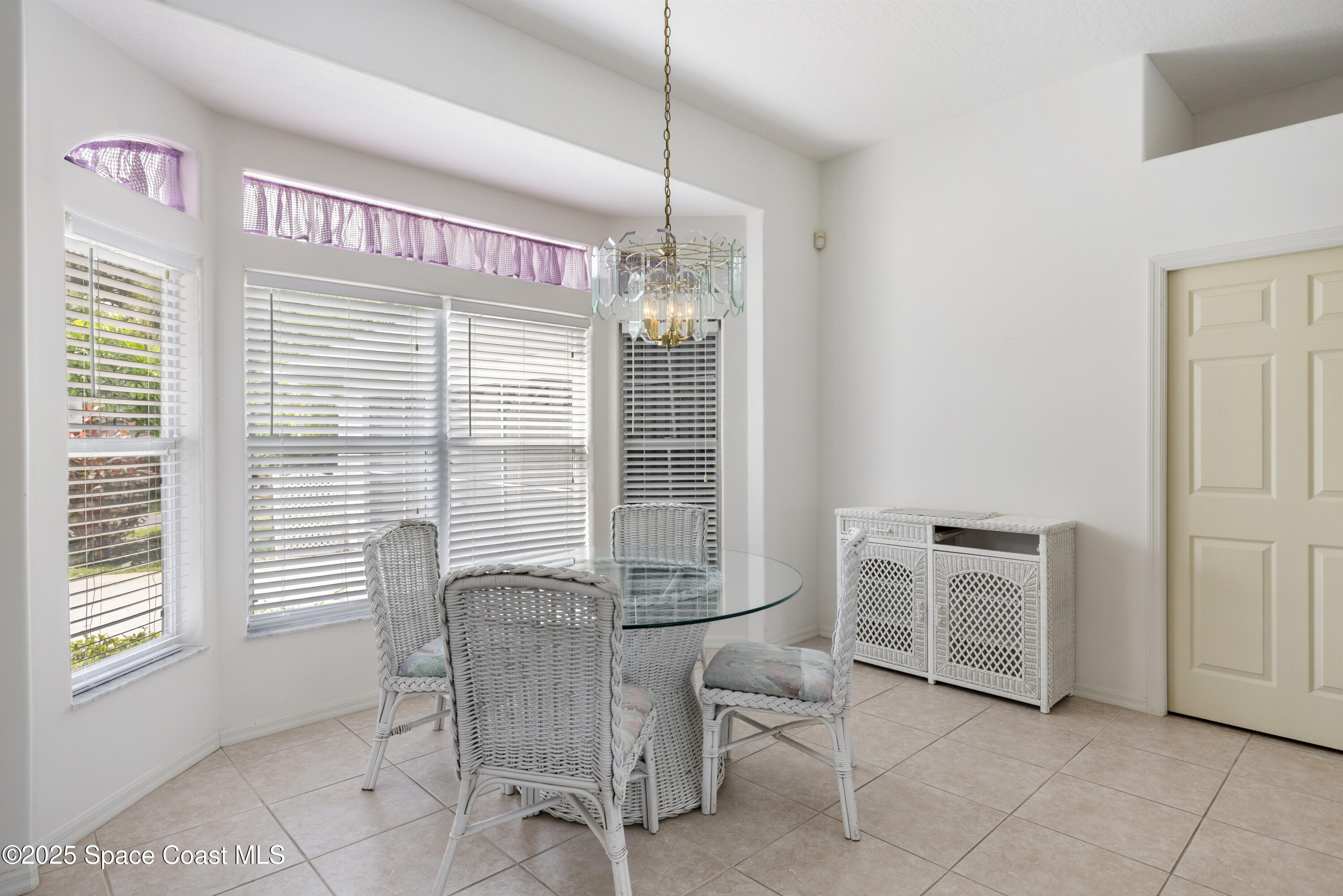 1253 George Street Sebastian, FL 32958 - Photo 17 of 37 a view of a dining room with furniture and windows