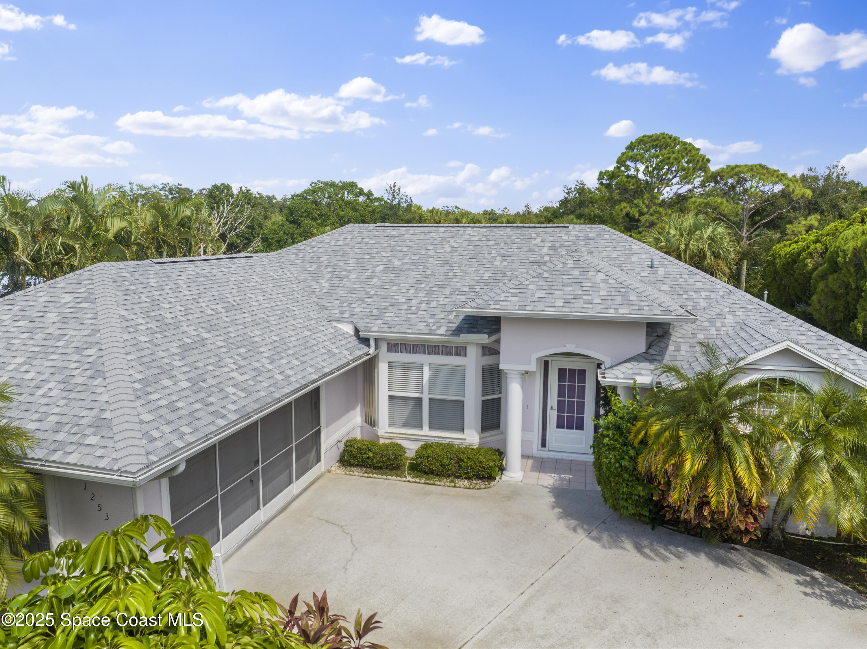 1253 George Street Sebastian, FL 32958 - Photo 2 of 37 a aerial view of a house with a yard and potted plants