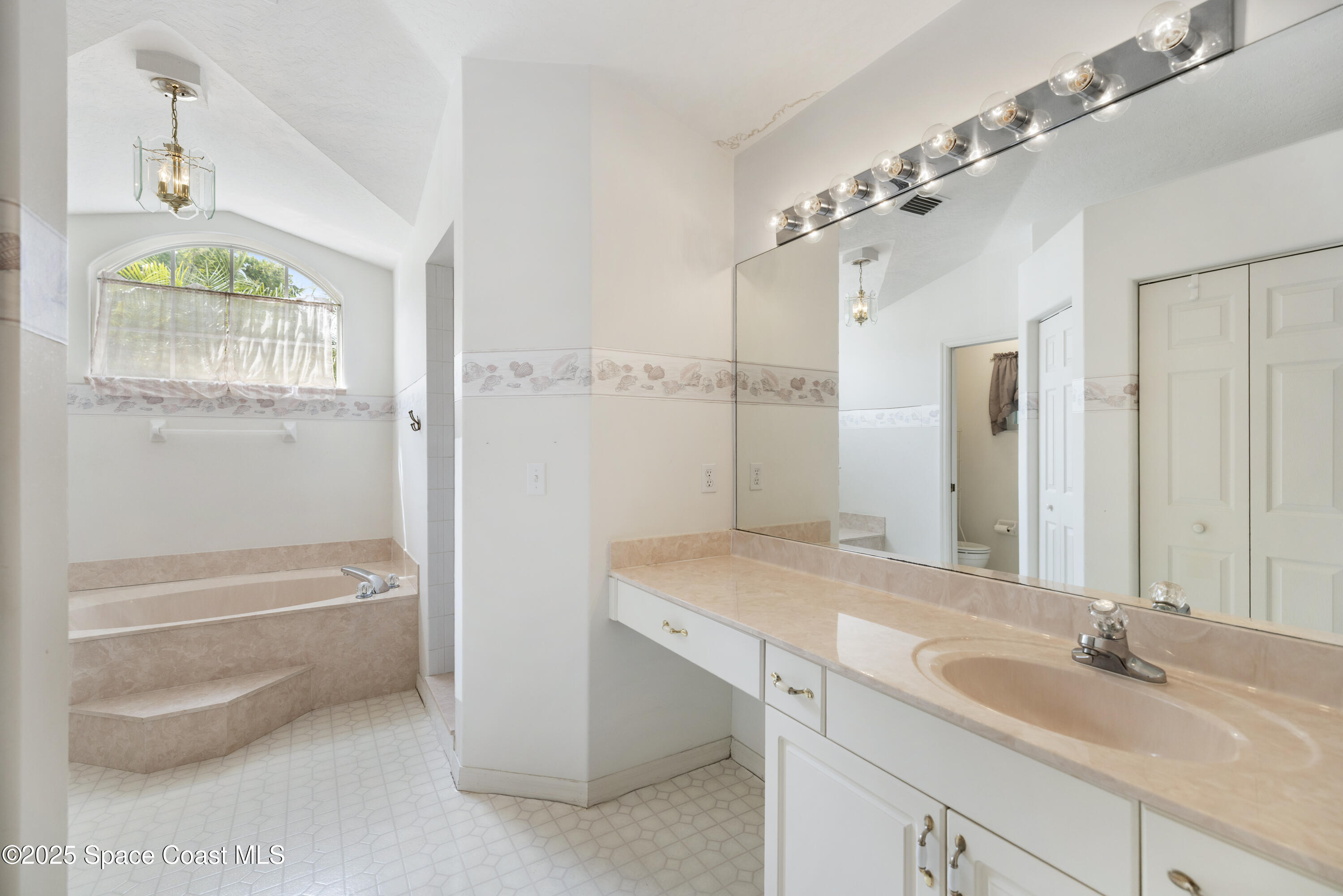 1253 George Street Sebastian, FL 32958 - Photo 21 of 37 a bathroom with a granite countertop sink a toilet and bathtub