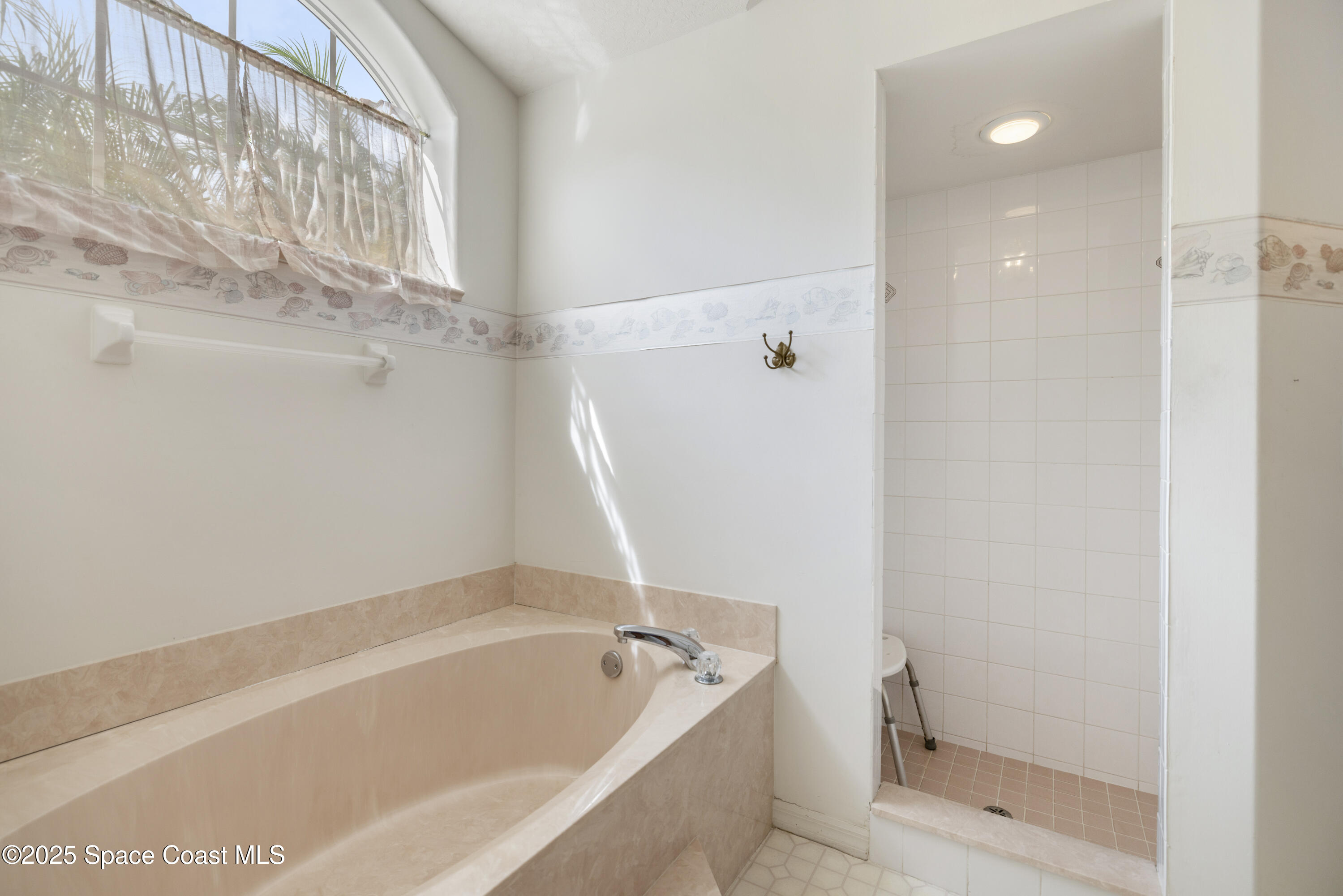 1253 George Street Sebastian, FL 32958 - Photo 22 of 37 a bathroom with a bathtub and shower