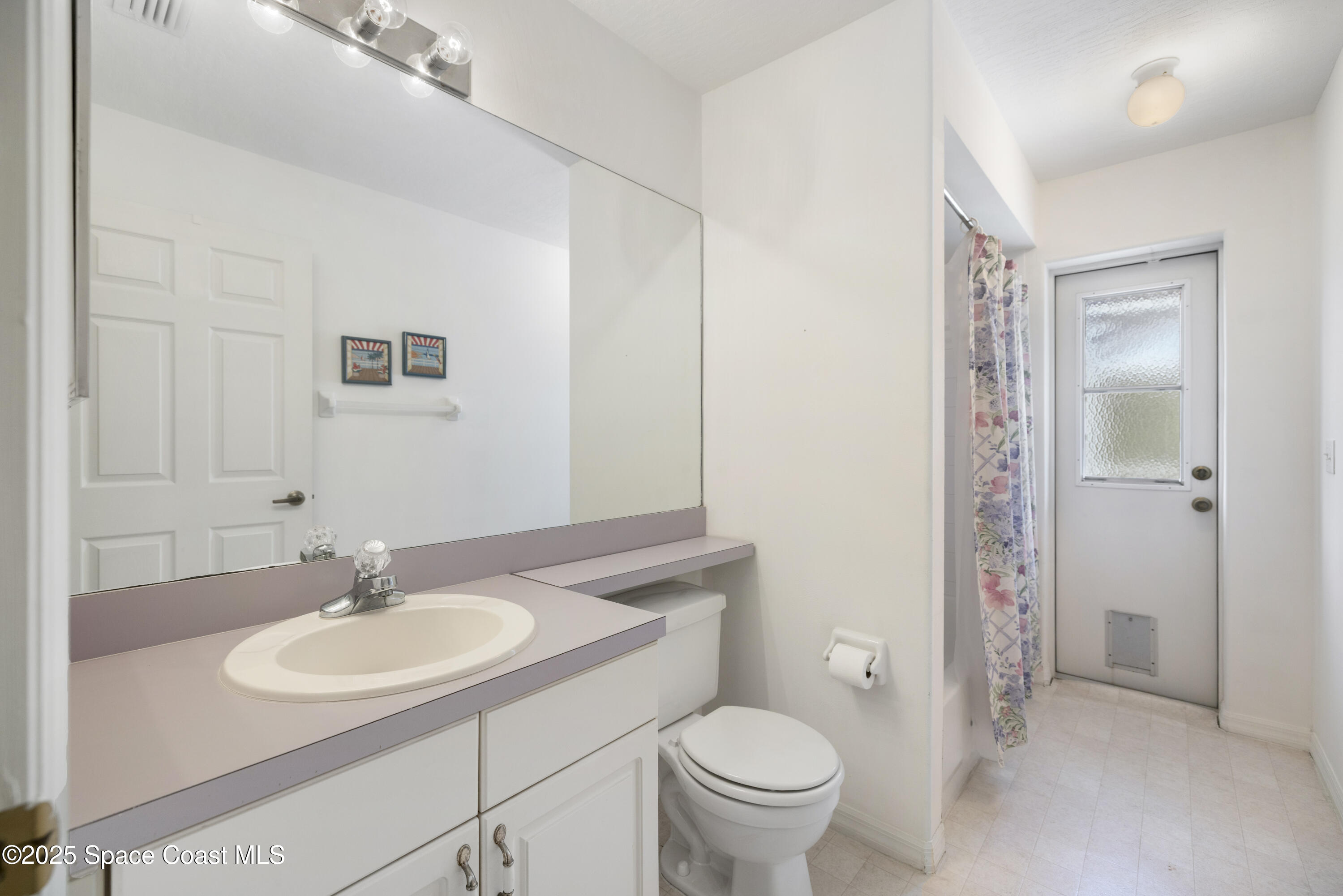 1253 George Street Sebastian, FL 32958 - Photo 25 of 37 a bathroom with a sink toilet and a mirror