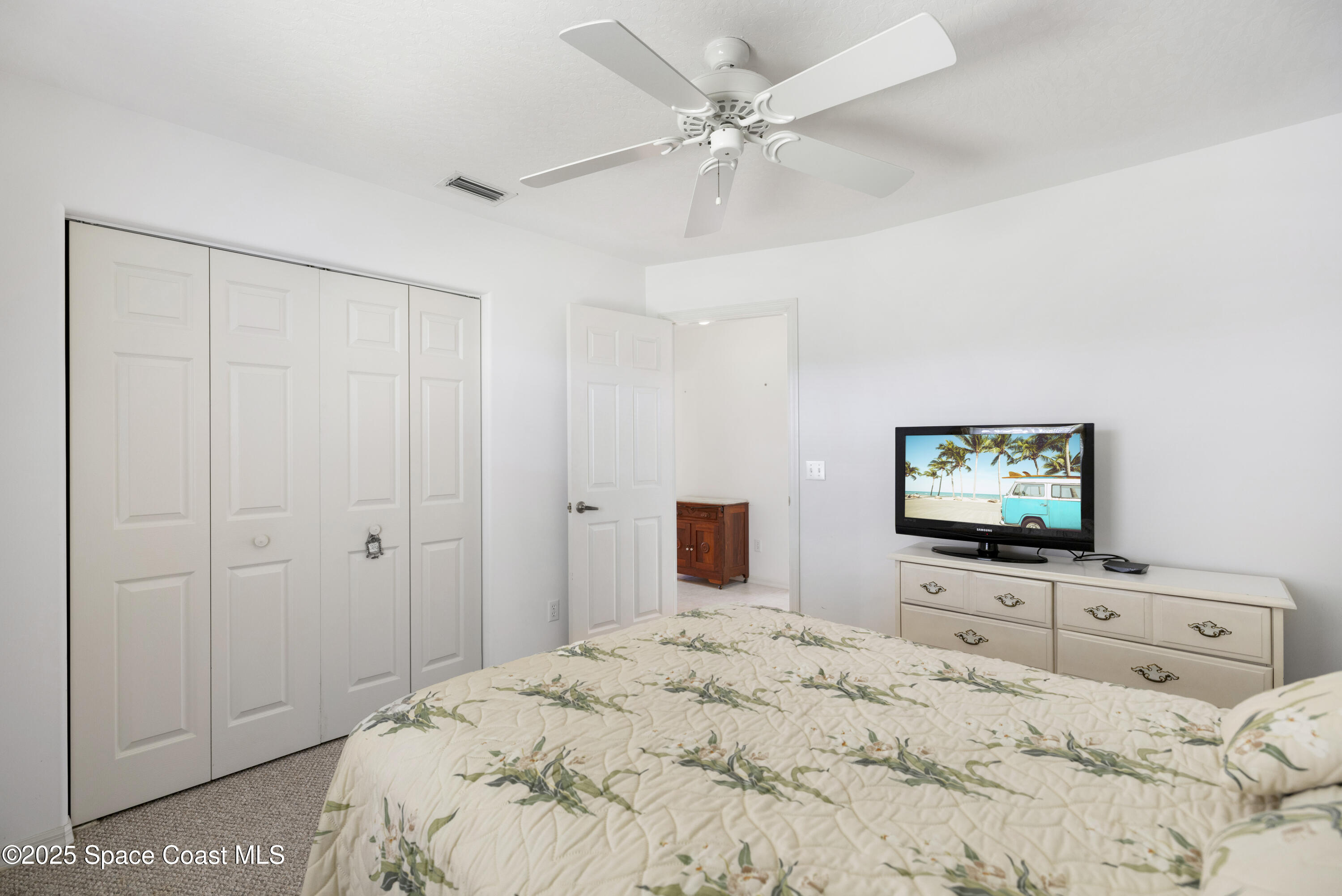 1253 George Street Sebastian, FL 32958 - Photo 26 of 37 a bedroom with a bed and a flat screen tv