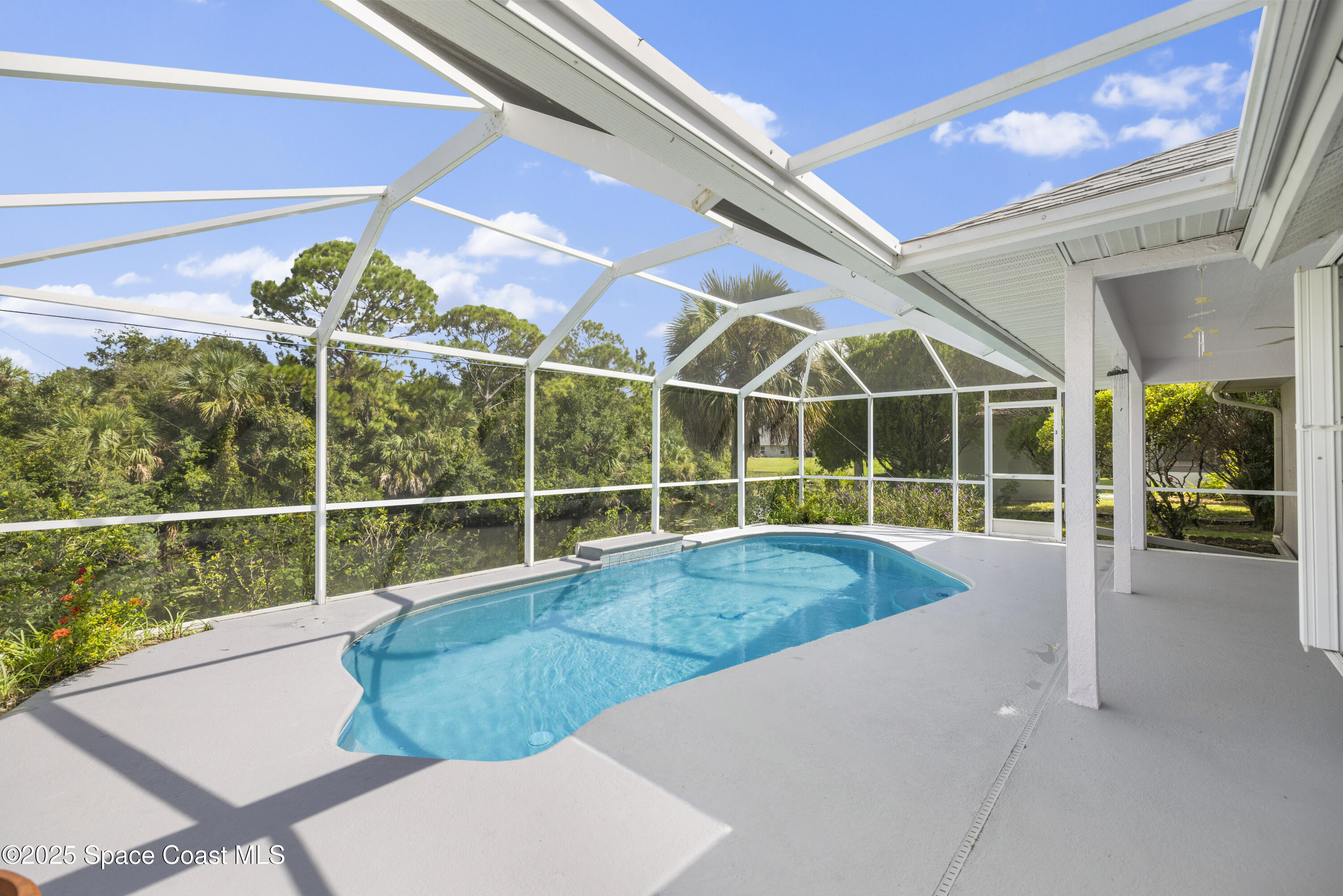 1253 George Street Sebastian, FL 32958 - Photo 27 of 37 a view of a swimming pool with a lounge chair
