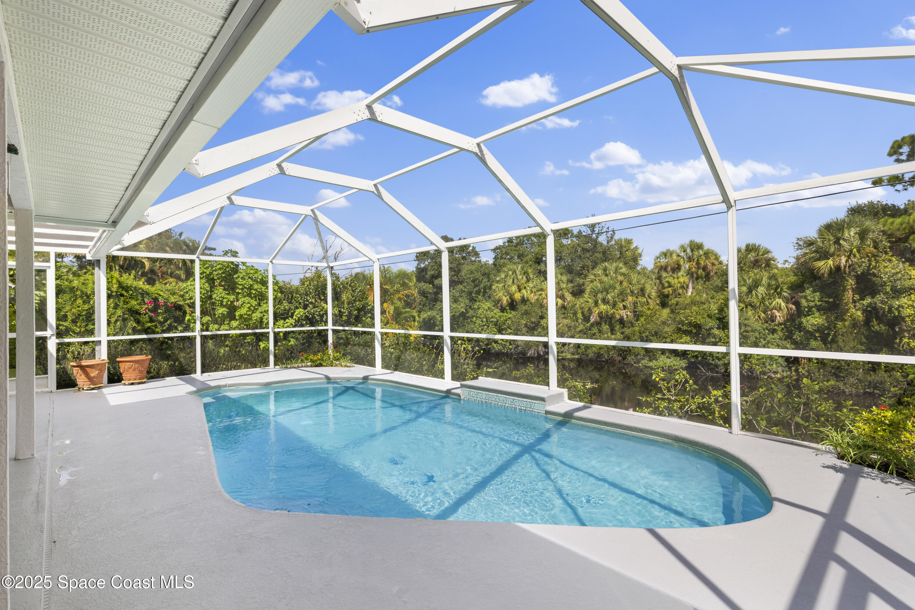 1253 George Street Sebastian, FL 32958 - Photo 30 of 37 a view of a swimming pool with a porch