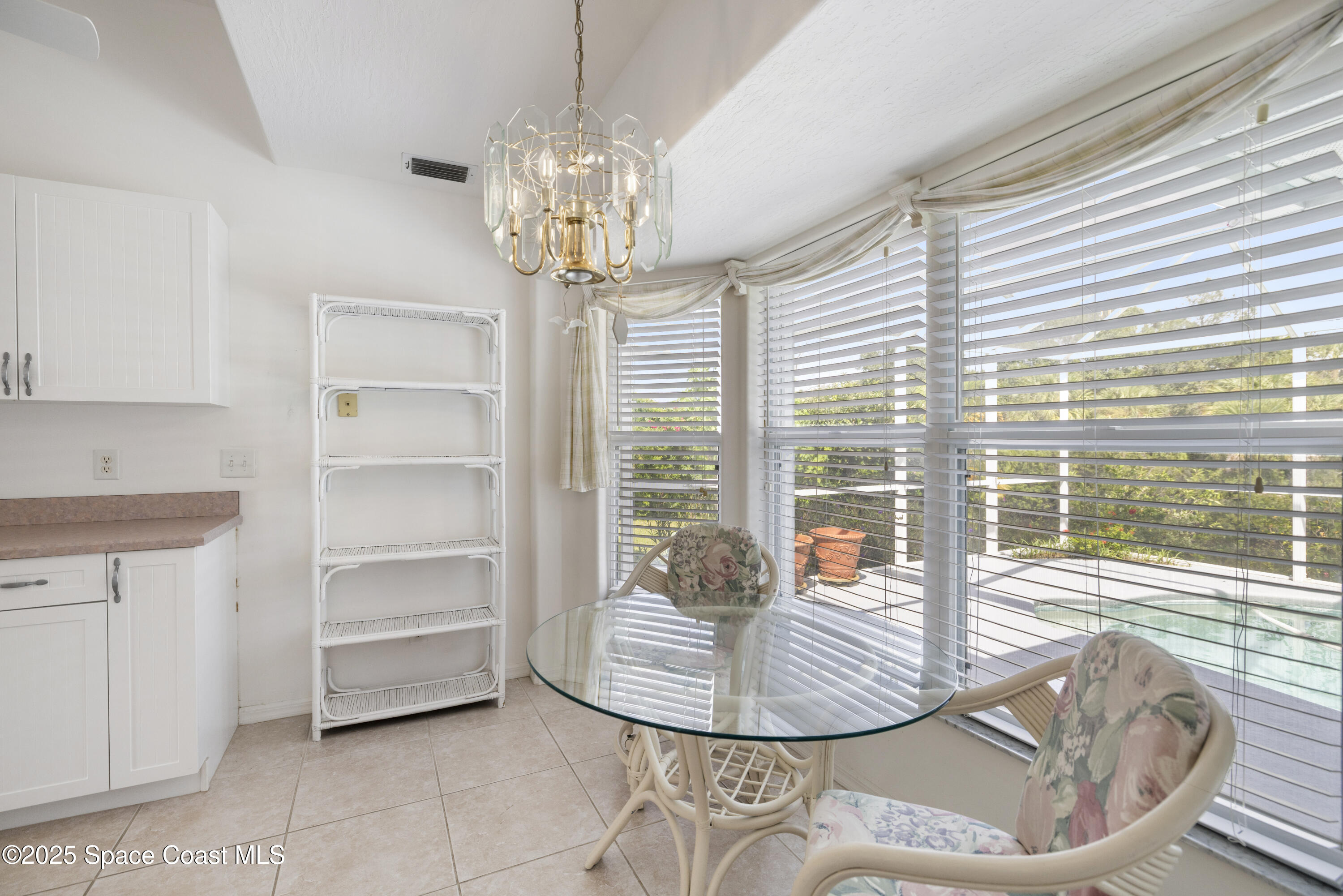 1253 George Street Sebastian, FL 32958 - Photo 9 of 37 a view of a dining room with furniture wooden floor and chandelier