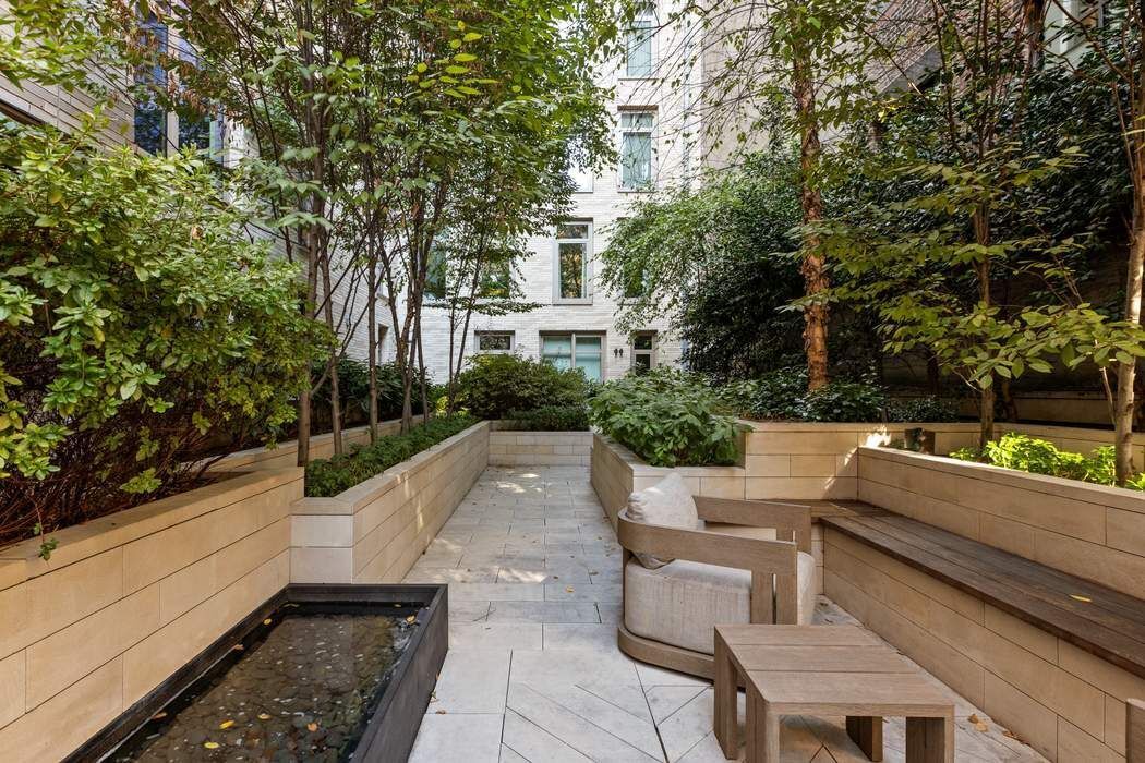 40 Bleecker Street, Unit 5D Manhattan, NY 10012 - Photo 13 of 17 a view of a patio with couches table and chairs and potted plants