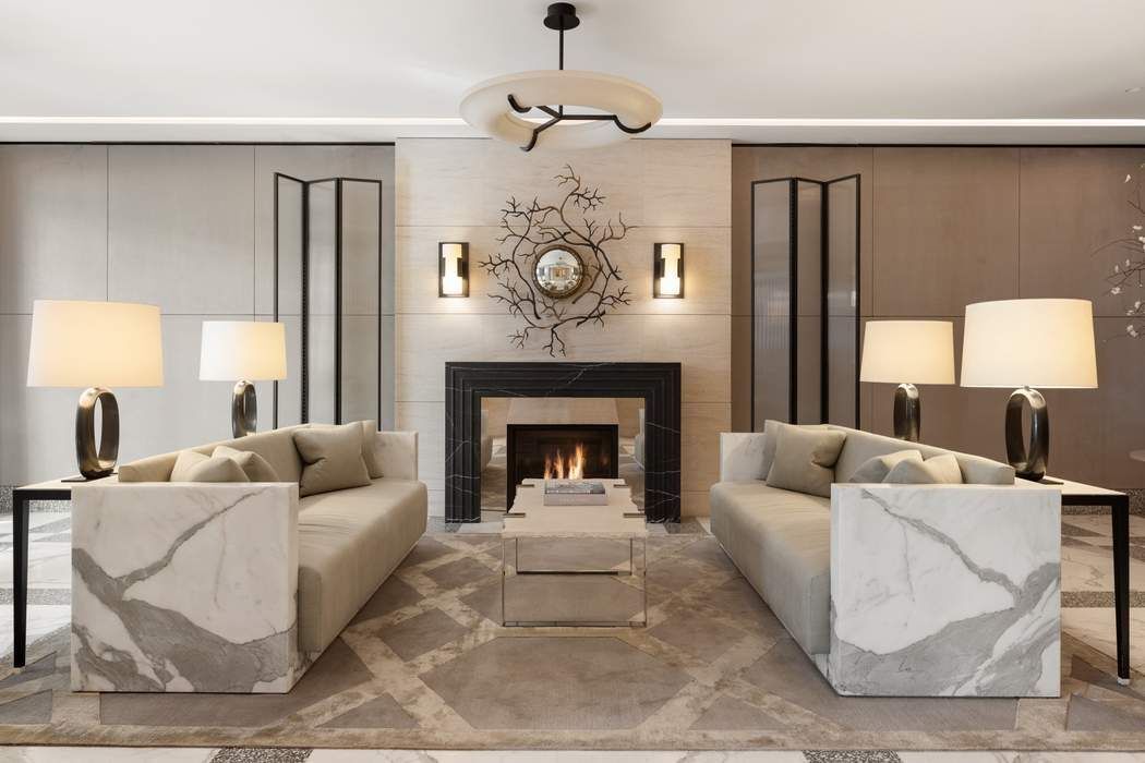 40 Bleecker Street, Unit 5D Manhattan, NY 10012 - Photo 14 of 17 a living room with furniture and a fireplace