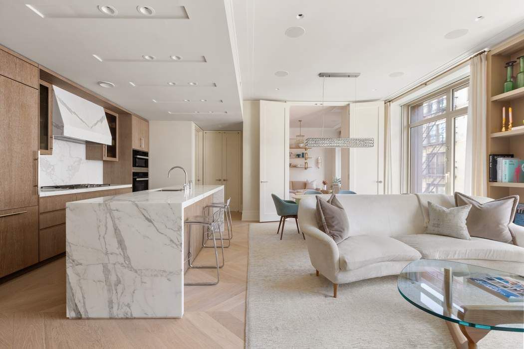 40 Bleecker Street, Unit 5D Manhattan, NY 10012 - Photo 2 of 17 a living room with furniture and a large window