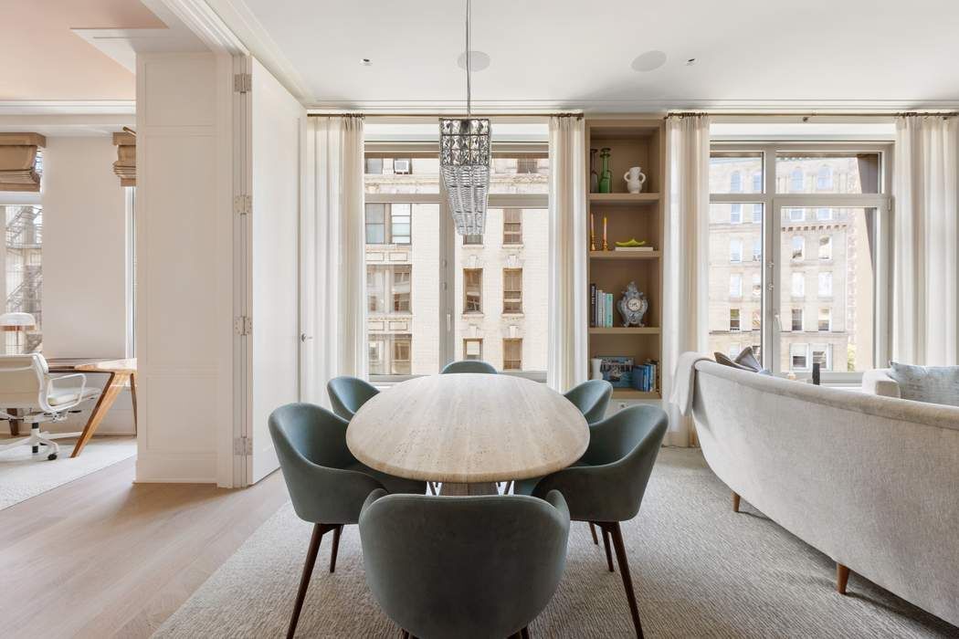 40 Bleecker Street, Unit 5D Manhattan, NY 10012 - Photo 4 of 17 a living room with furniture and a large window