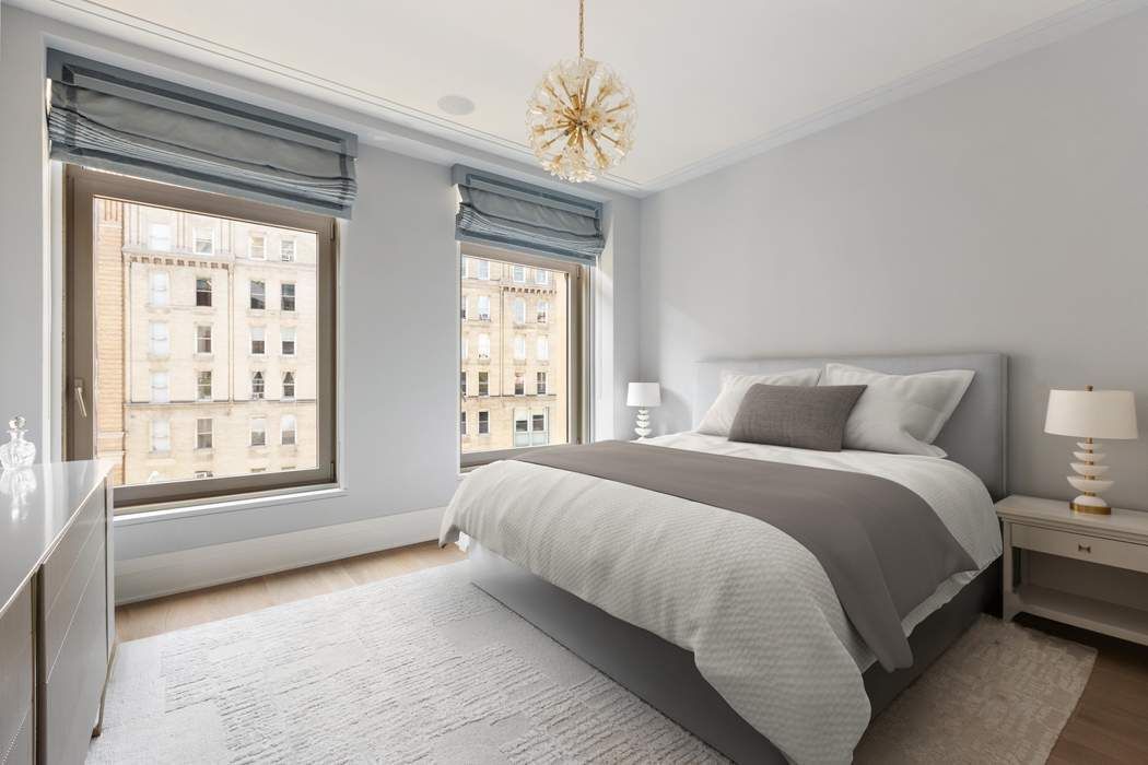 40 Bleecker Street, Unit 5D Manhattan, NY 10012 - Photo 8 of 17 a spacious bedroom with a bed and a window