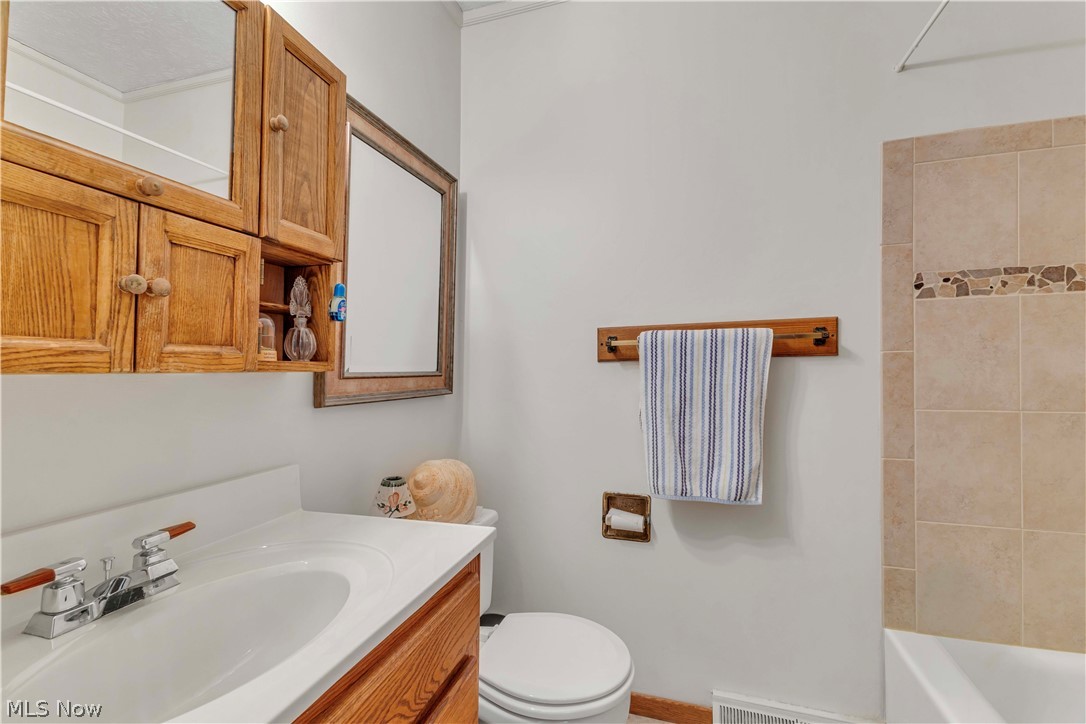 563 North Carpenter Road Brunswick, OH 44212 - Photo 27 of 45 Bathroom featuring vanity and washtub / shower combination
