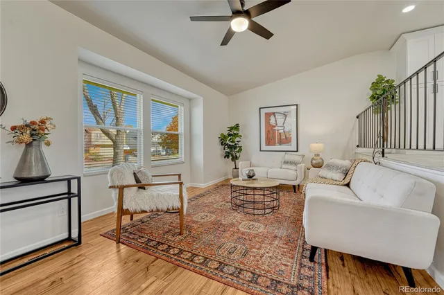a bedroom with a bed and a ceiling fan