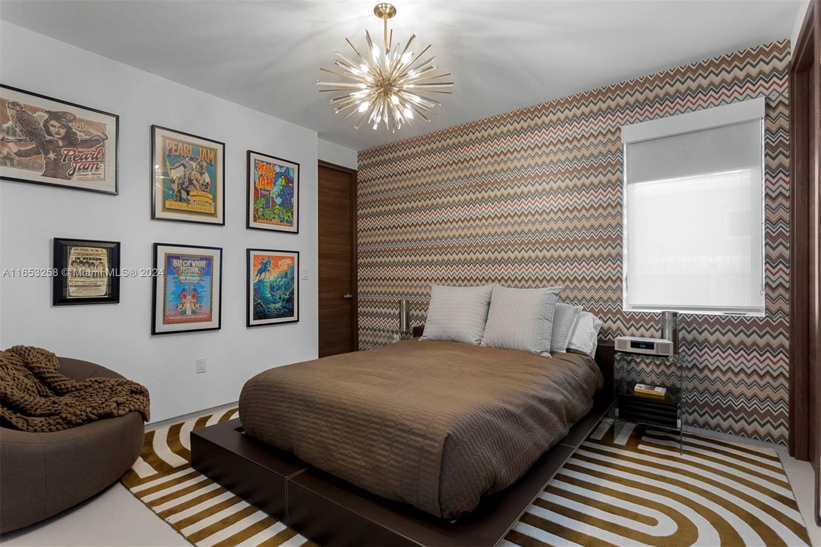 1701 Southwest 4th Avenue Miami, FL 33129 - Photo 11 of 32 a bedroom with a bed and a chandelier