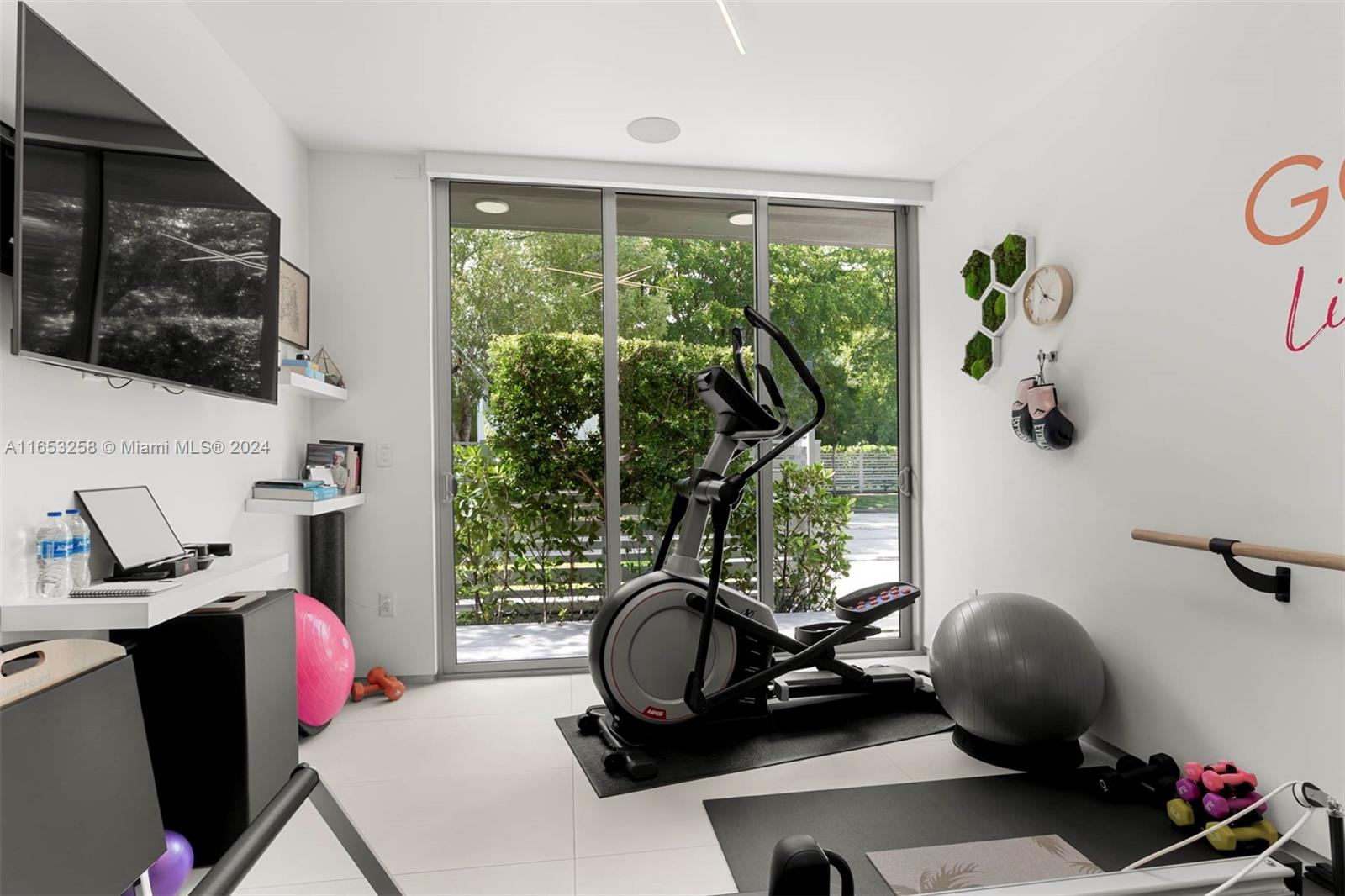 1701 Southwest 4th Avenue Miami, FL 33129 - Photo 13 of 32 a view of a workspace with furniture and a window