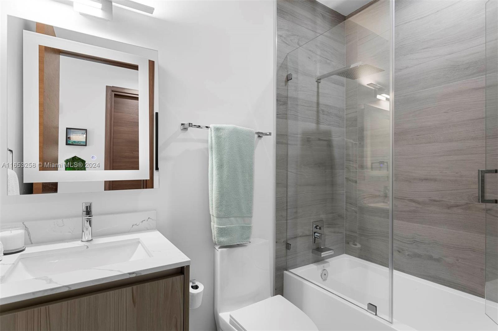 1701 Southwest 4th Avenue Miami, FL 33129 - Photo 14 of 32 a bathroom with a granite countertop sink toilet and shower