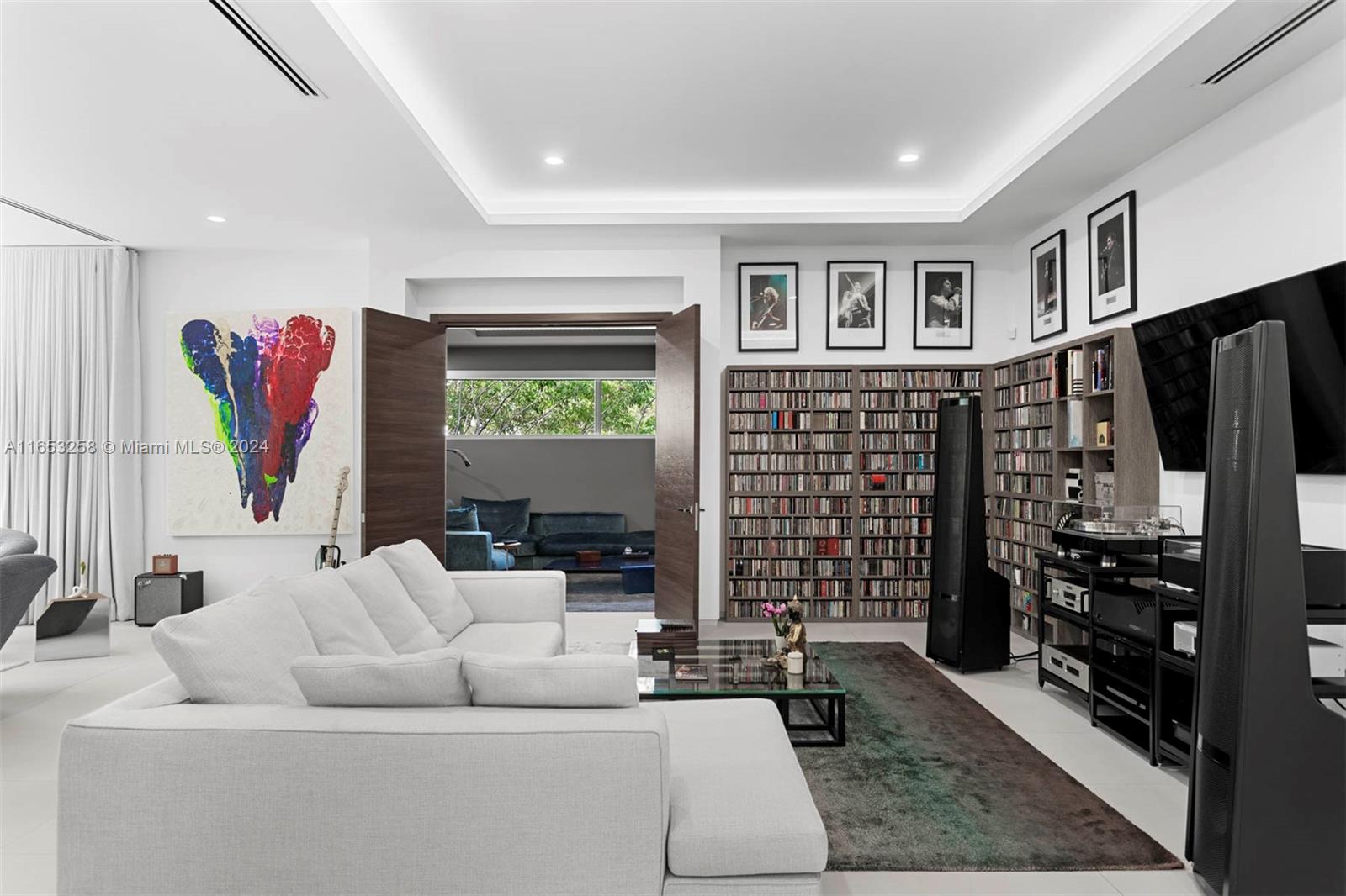 1701 Southwest 4th Avenue Miami, FL 33129 - Photo 19 of 32 a living room with furniture a window and a flat screen tv