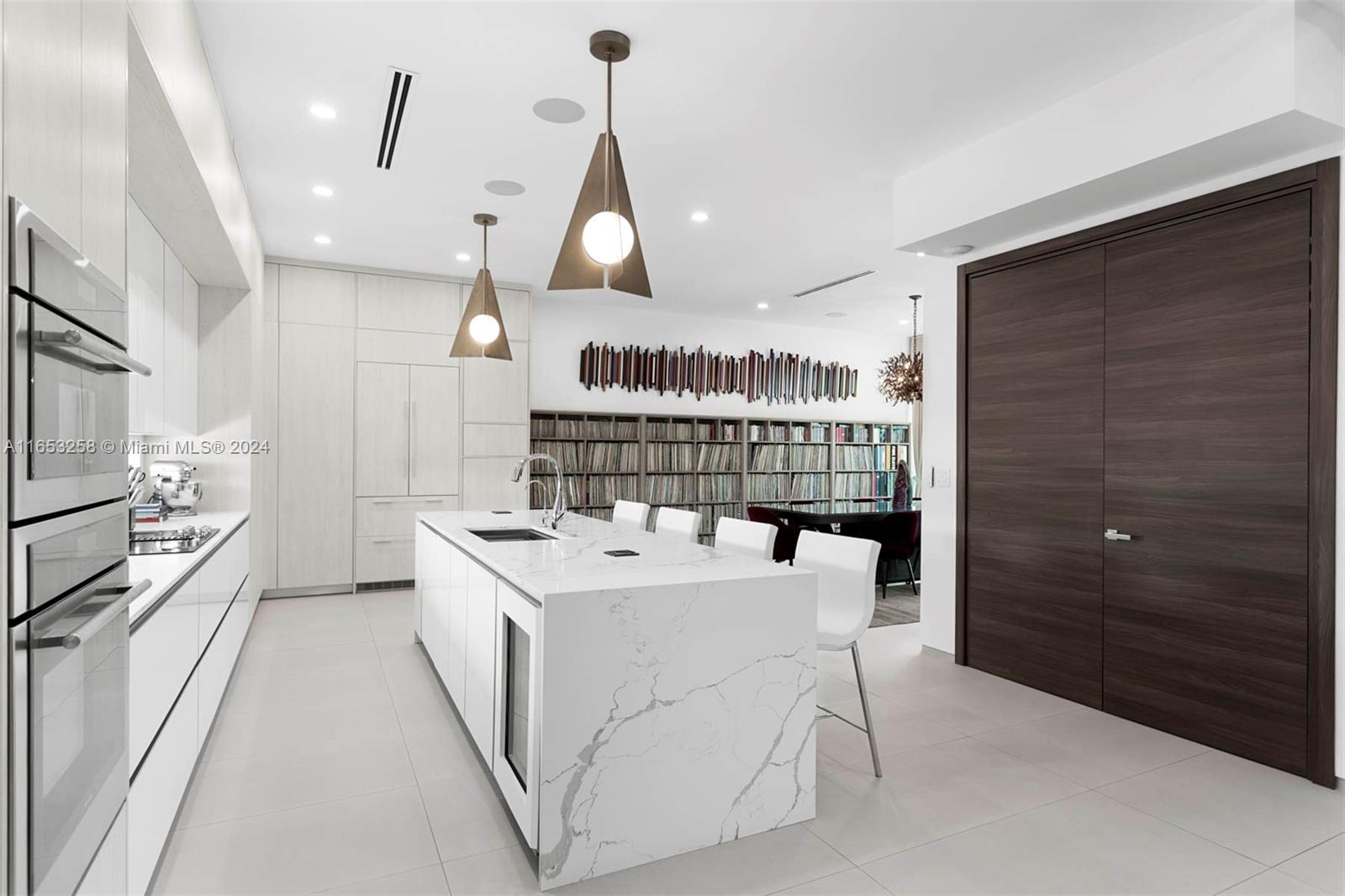 1701 Southwest 4th Avenue Miami, FL 33129 - Photo 22 of 32 a kitchen with a sink a stove and cabinets