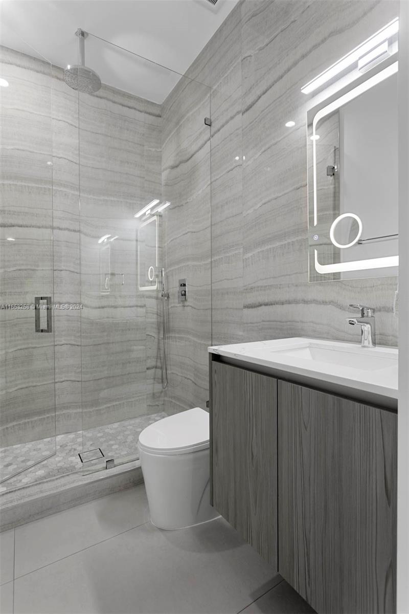 1701 Southwest 4th Avenue Miami, FL 33129 - Photo 25 of 32 a bathroom with a sink a toilet and shower