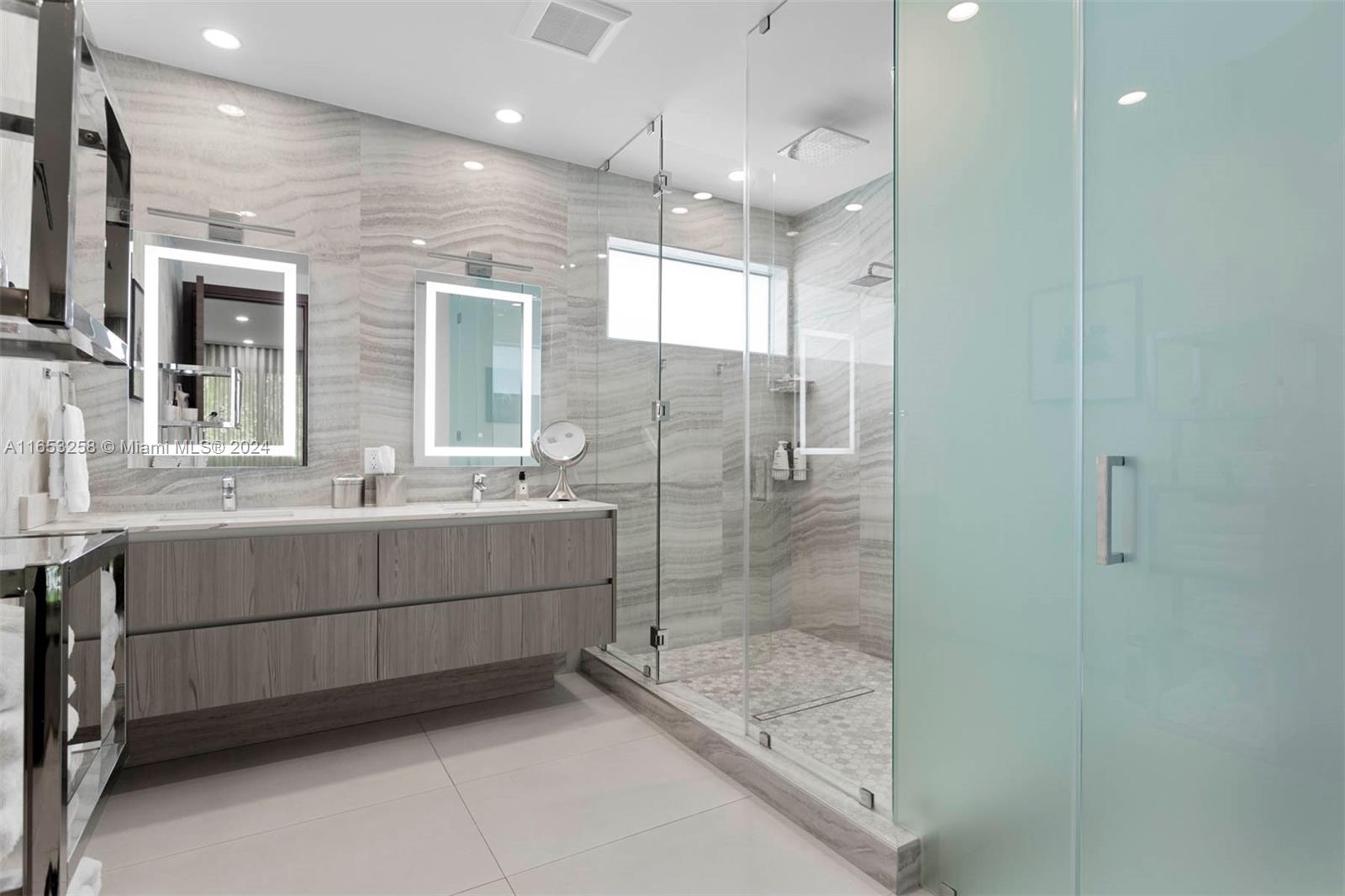 1701 Southwest 4th Avenue Miami, FL 33129 - Photo 7 of 32 a bathroom with a shower a sink and mirror