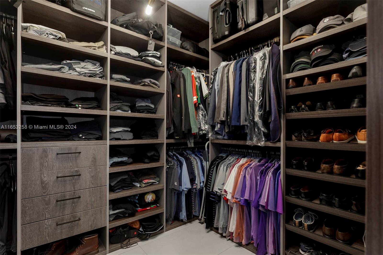 1701 Southwest 4th Avenue Miami, FL 33129 - Photo 10 of 32 a view of walk in closet with clothes and shoes