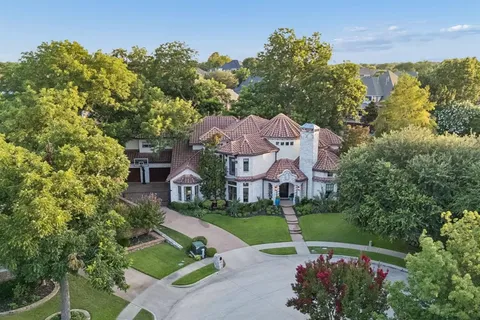 an aerial view of a house with a garden