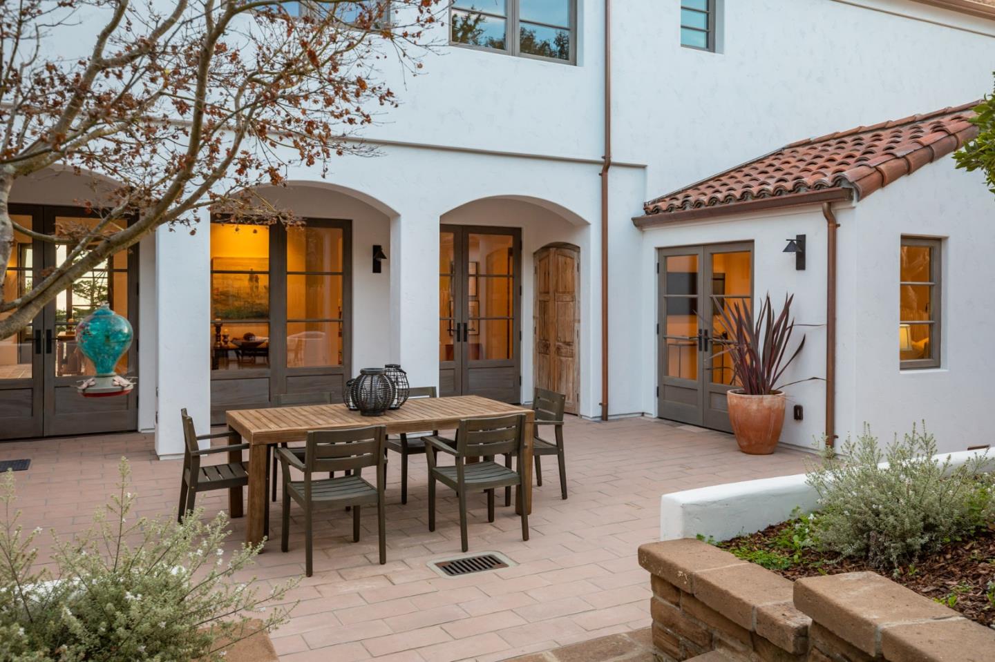 1605 Sonado Road Pebble Beach, CA 93953 - Photo 12 of 33 a view of a dinning table and chairs in patio