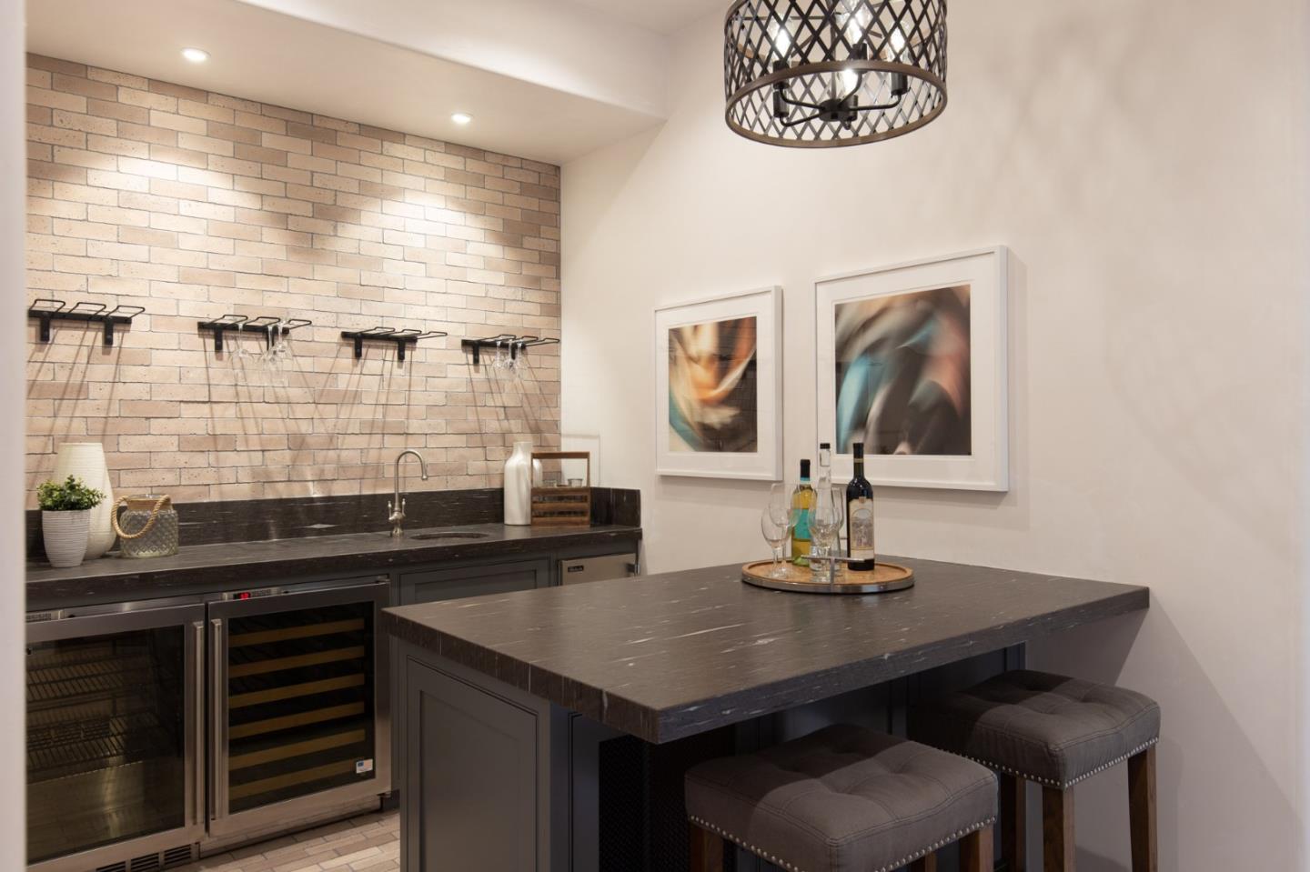 1605 Sonado Road Pebble Beach, CA 93953 - Photo 18 of 33 a kitchen with a sink cabinets and wooden floor