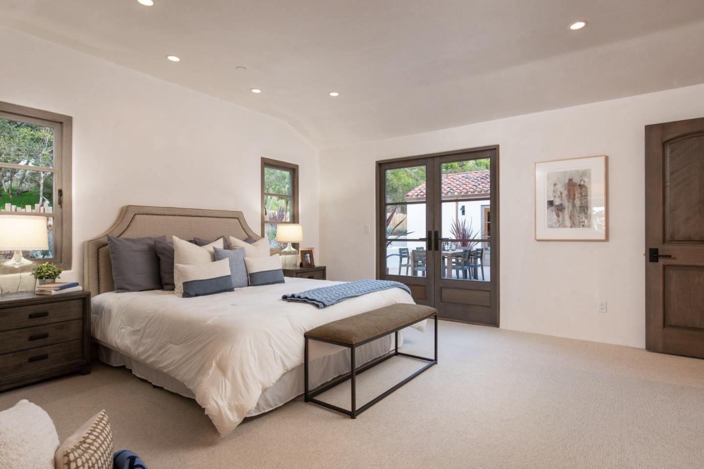 1605 Sonado Road Pebble Beach, CA 93953 - Photo 23 of 33 a bedroom with a bed and a night stand