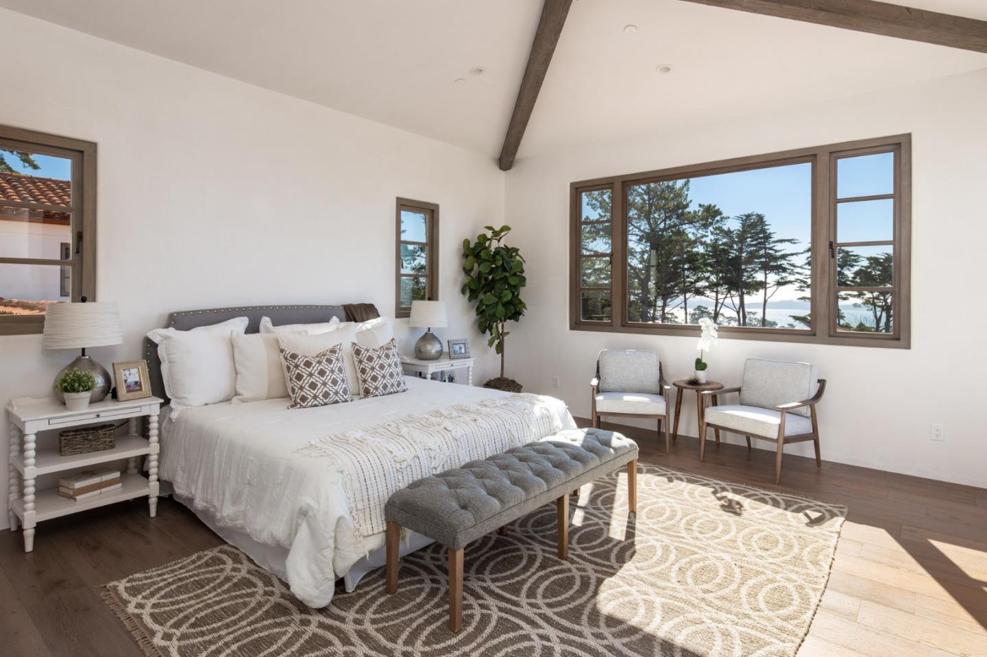 1605 Sonado Road Pebble Beach, CA 93953 - Photo 28 of 33 a bedroom with a large bed and a window