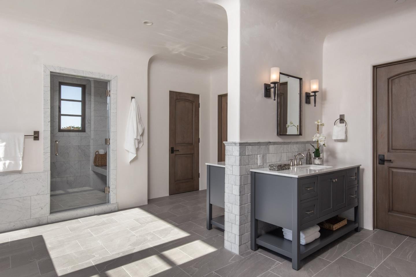 1605 Sonado Road Pebble Beach, CA 93953 - Photo 32 of 33 a bathroom with a sink and a mirror