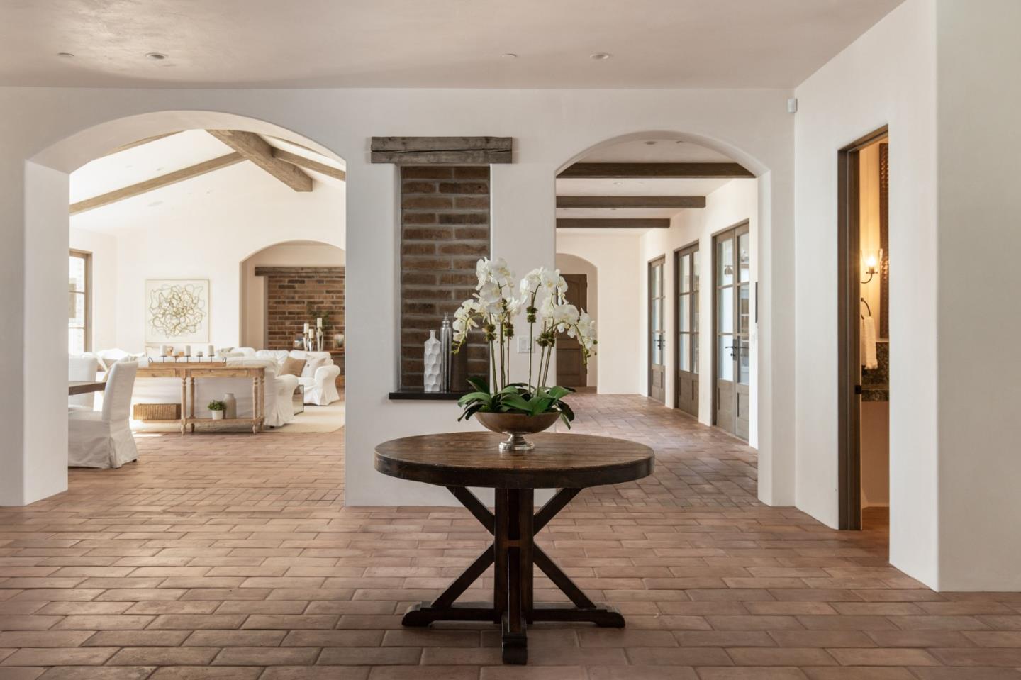1605 Sonado Road Pebble Beach, CA 93953 - Photo 5 of 33 a living room with furniture and a chandelier