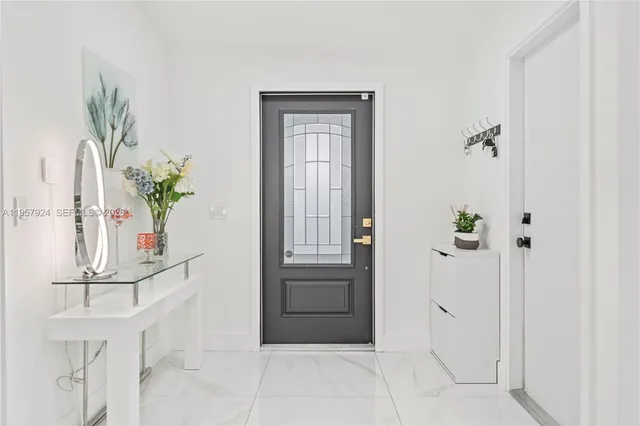 a view of entryway with wooden floor