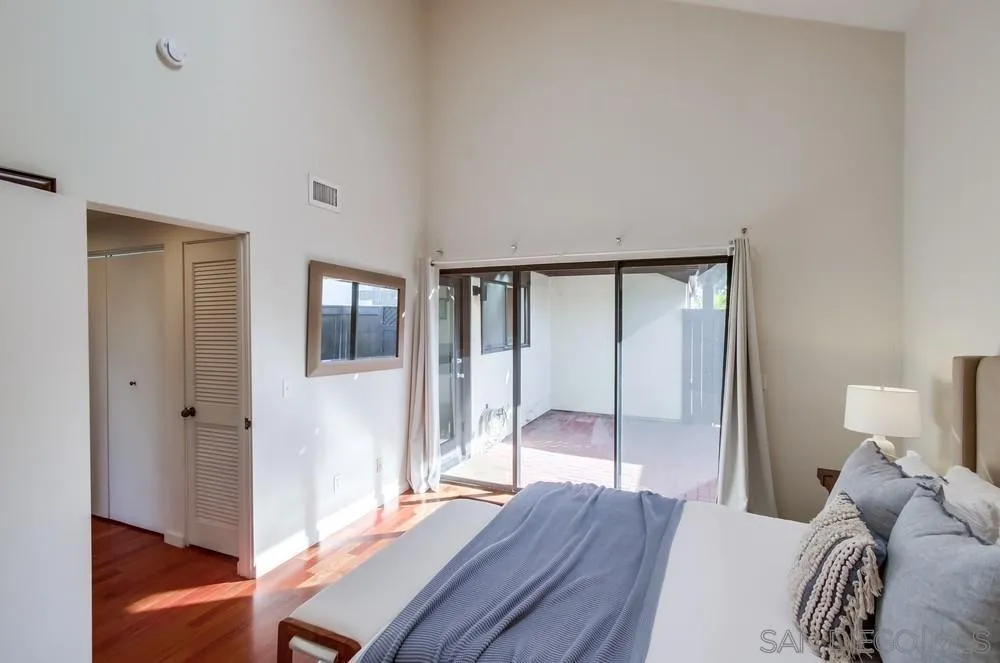 141 Sea Cliff Way Del Mar, CA 92014 - Photo 20 of 65 a bedroom with a bed and wooden floor