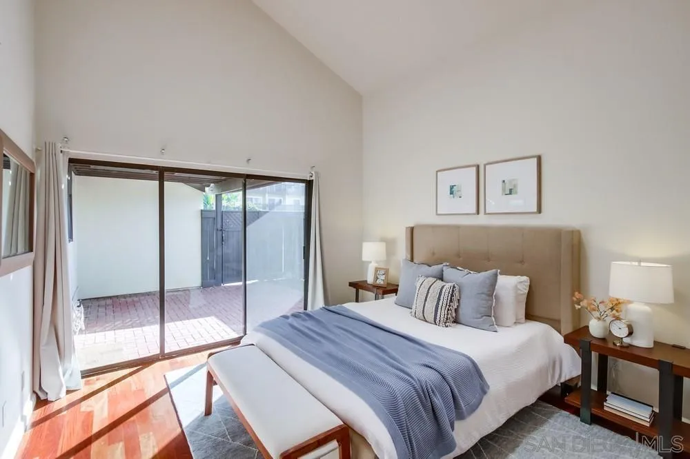 141 Sea Cliff Way Del Mar, CA 92014 - Photo 21 of 65 a bedroom with a bed and a glass door