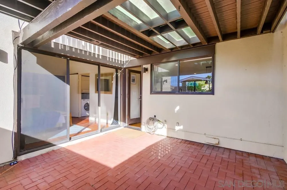 141 Sea Cliff Way Del Mar, CA 92014 - Photo 28 of 65 a bedroom with a bed and a large window