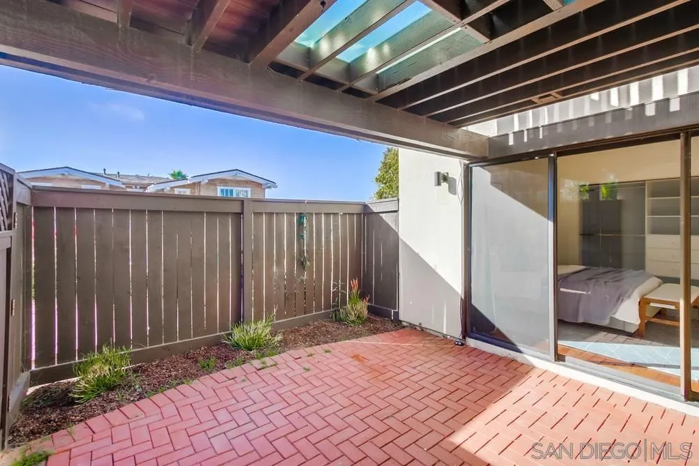 141 Sea Cliff Way Del Mar, CA 92014 - Photo 30 of 65 a view of a porch with furniture and a yard