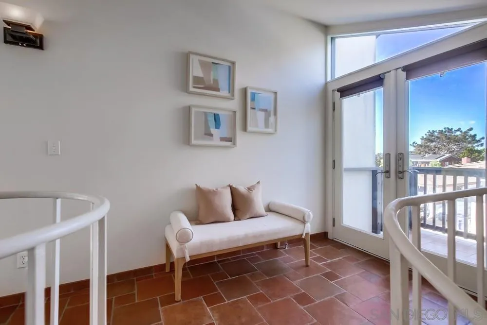 141 Sea Cliff Way Del Mar, CA 92014 - Photo 31 of 65 a living room with furniture and a window
